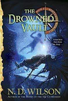 The Drowned Vault, by N.D. Wilson, Ashtown Burials II. The cover features a man with a lot of hair chained down to a vault deep in the sea: a boy with a knife and light descends in the water to him.
